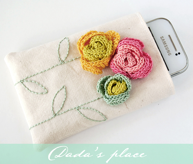 Phone pouch with crochet flowers